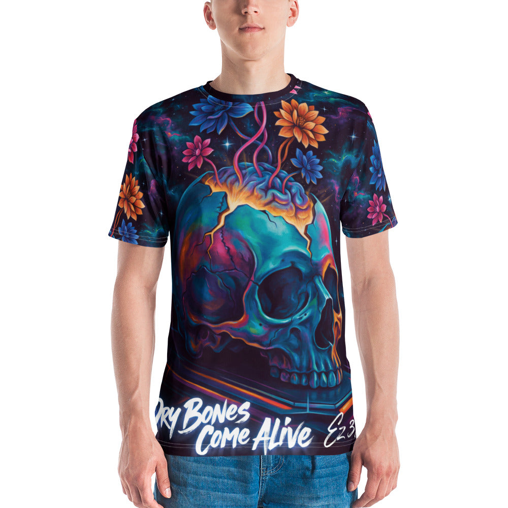 A man wearing a short-sleeve crewneck Christian t-shirt with a vibrant, colorful graphic print. The design features a glowing teal and blue skull with orange and purple details, surrounded by stylized flowers on a dark background with qoute "Dry Bones Come Alive Ez 37" at bottom.