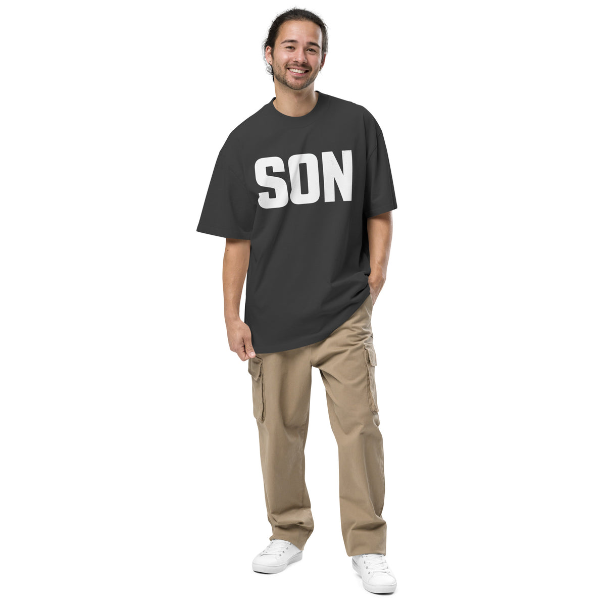 Man wearing an oversized grey Christian T shirt with "SON" in big letters across the front