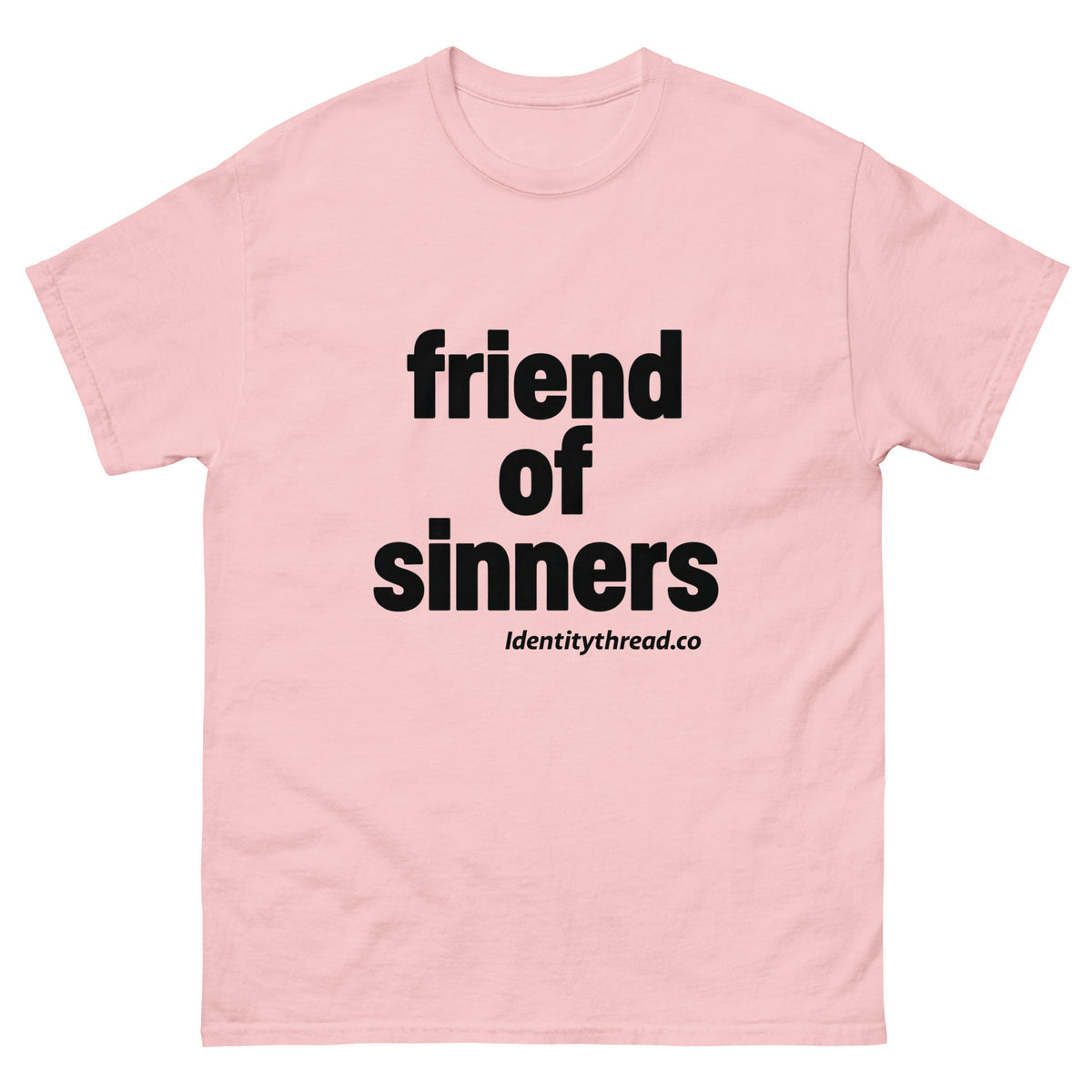 A light pink short-sleeve crewneck Christian t-shirt with bold black text reading 'friend of sinners' and smaller text 'identitythread.co' underneath, displayed on a clean white background.