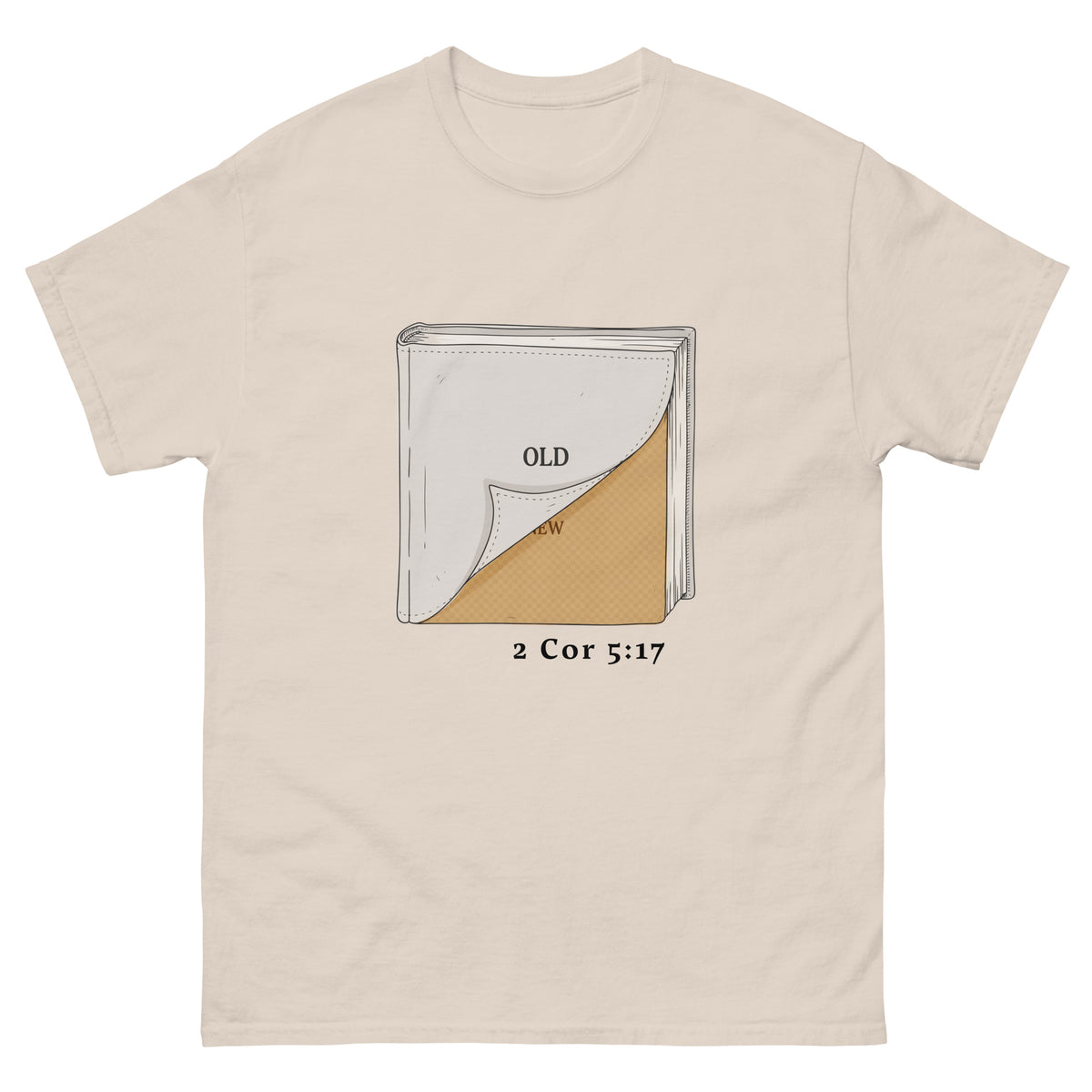 A light beige crewneck Christian t-shirt featuring a graphic of a Bible with one corner peeled back to reveal a textured gold interior, with the text 'OLD' and '2 Cor 5:17' printed below.