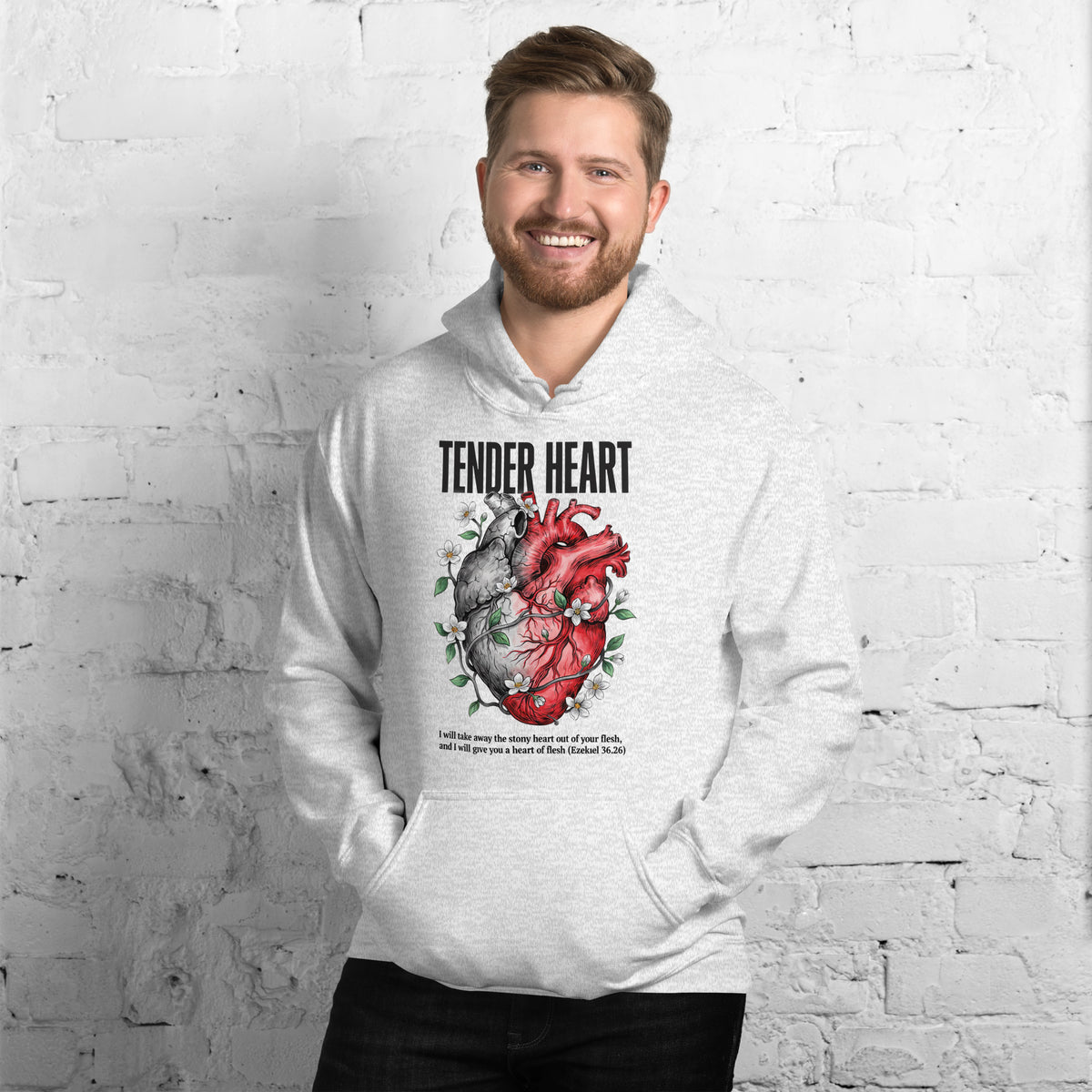 Man in a ash colored Christian hoodie featuring Ezekiel 36:26