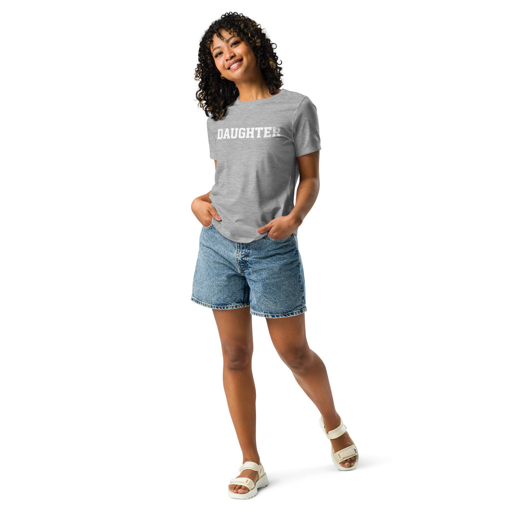 Woman wearing a gray Christian T shirt that says "Daughter" in white text